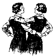Black and white photograph of two old-fashioned schoolgirls with their arms entwined