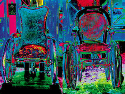 Brightly coloured photograph of two armchair-type wheelchairs